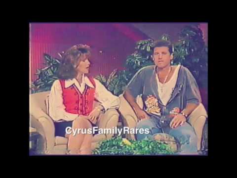 Thumbnail for Miley Cyrus in 1995 cries after getting splashed at Opery Land.