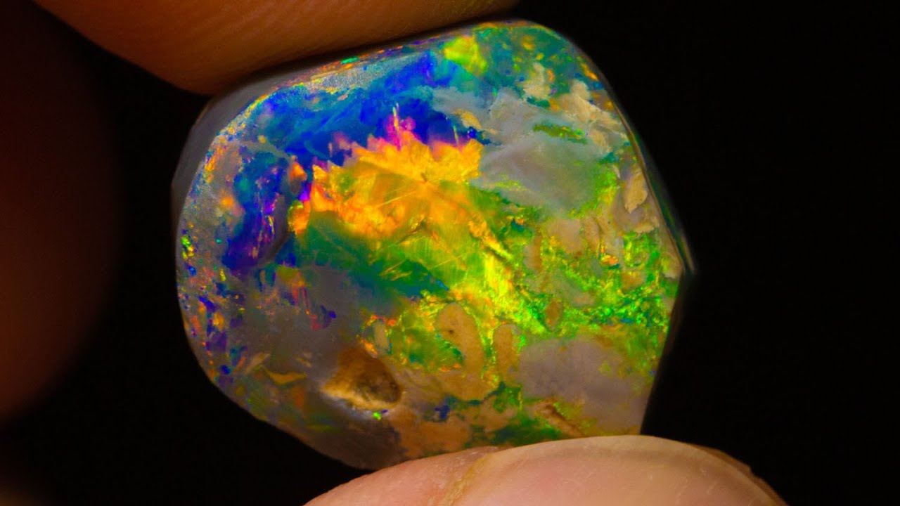 Thumbnail for $20k gem black opal emerges from this uncut rough opal