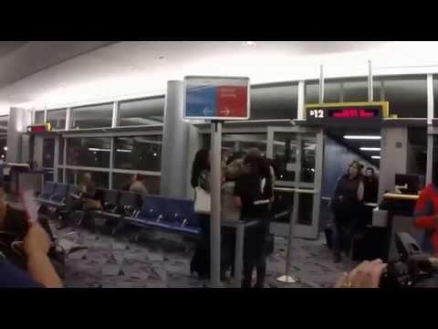 Thumbnail for Soldier returns home from Afghanistan. Famiy and strangers greet him with cheers and aplause.